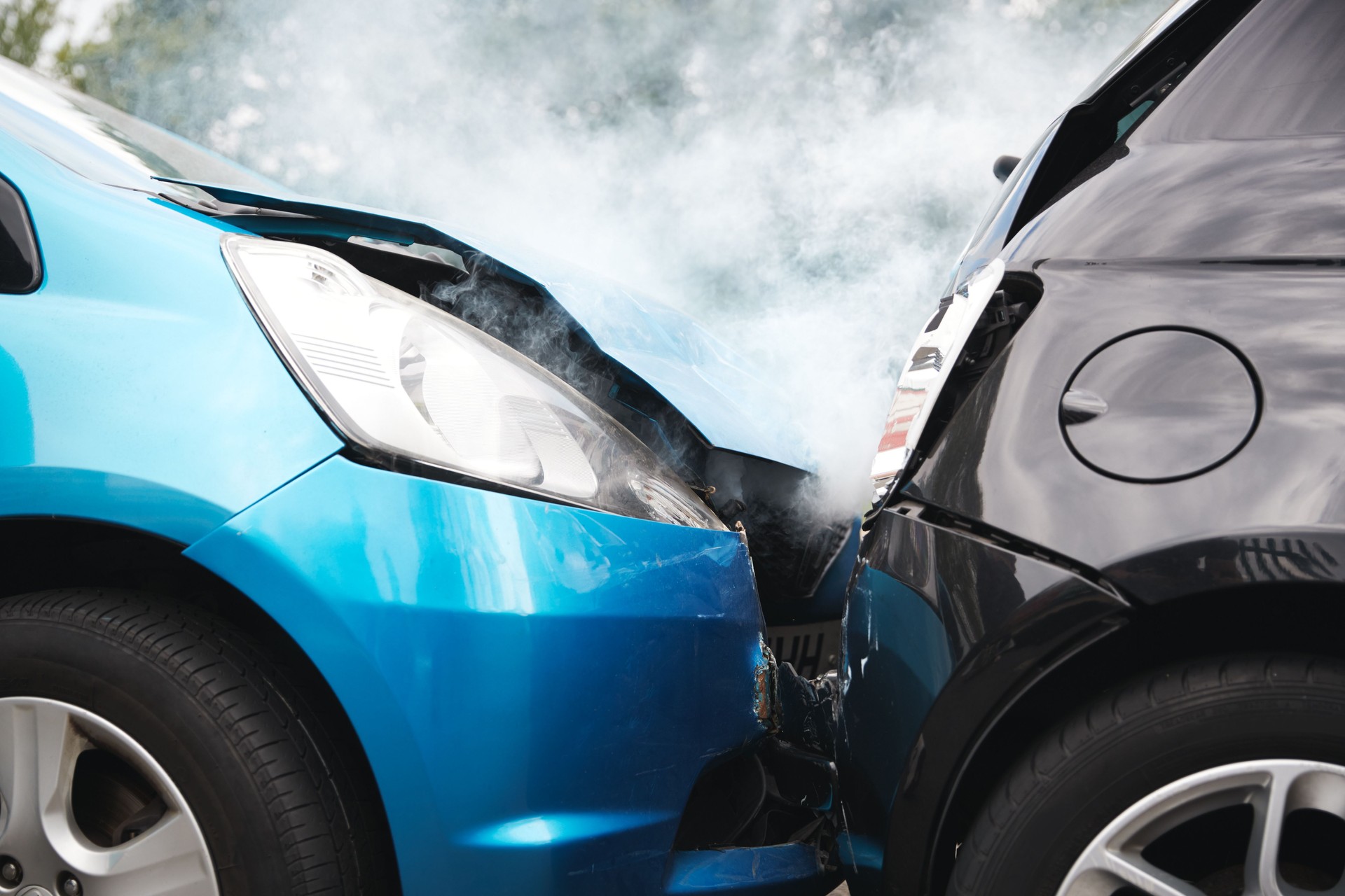 Close Up Of Two Cars Damaged In Road Traffic Accident